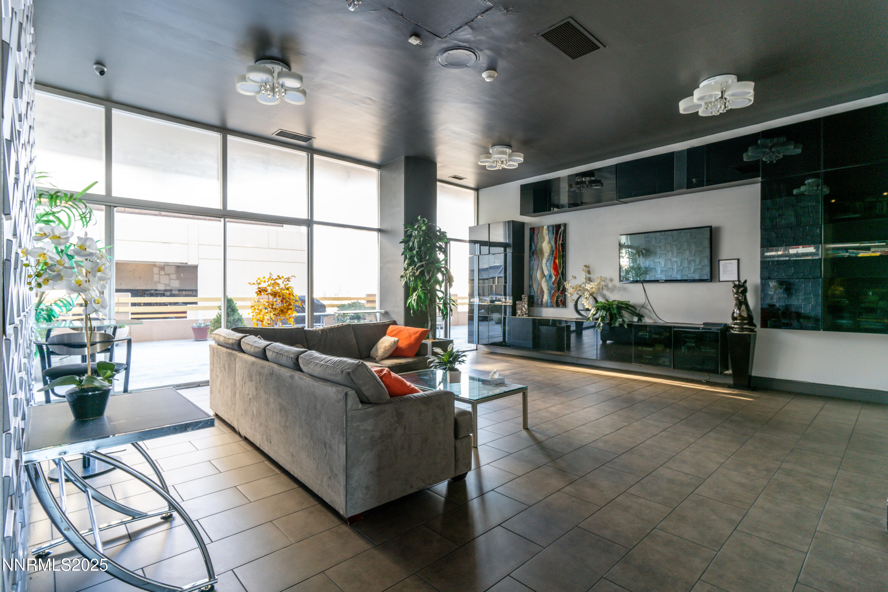 100 North Arlington Avenue, Unit 7I Reno, NV 89501 - Photo 19 of 25 a living room with furniture and a large window