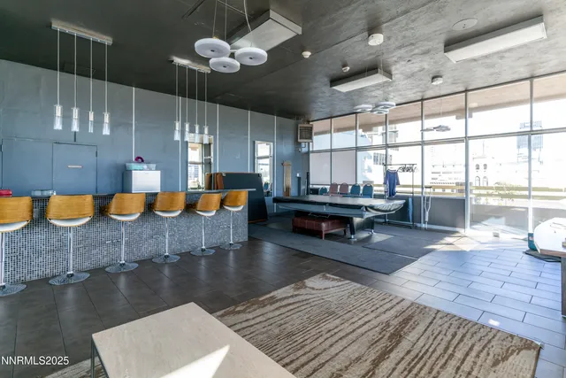 a living room with lots of furniture and a chandelier