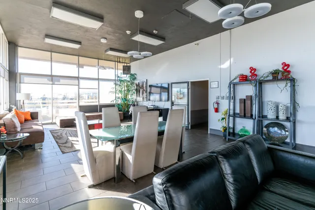 a view of a dining room with furniture window and outside view