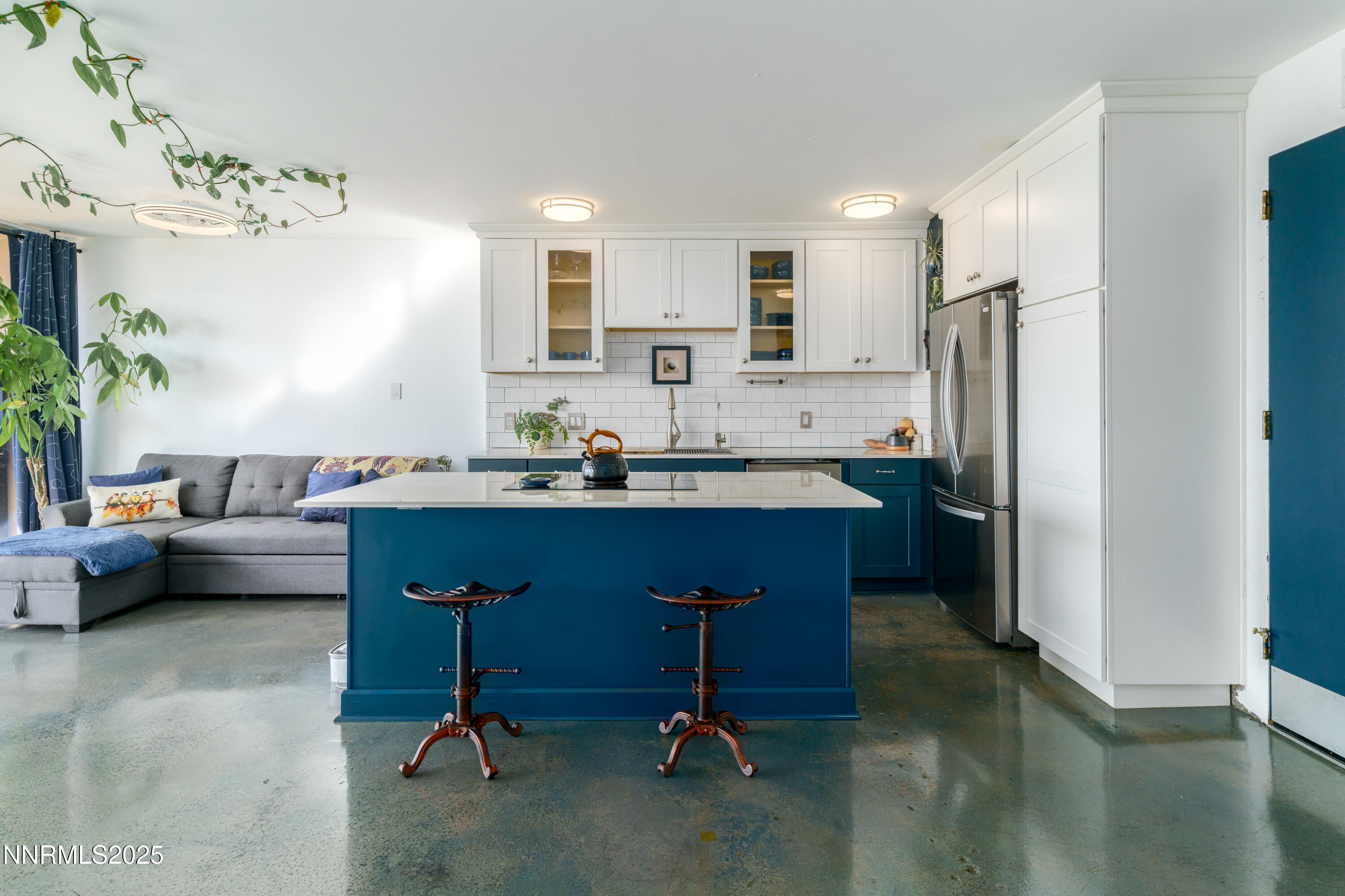 100 North Arlington Avenue, Unit 7I Reno, NV 89501 - Photo 6 of 25 a kitchen with a refrigerator and a sink
