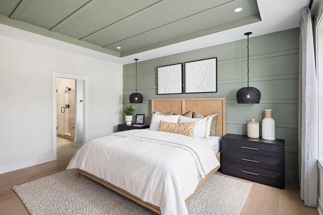 a bedroom with a bed and a table in it