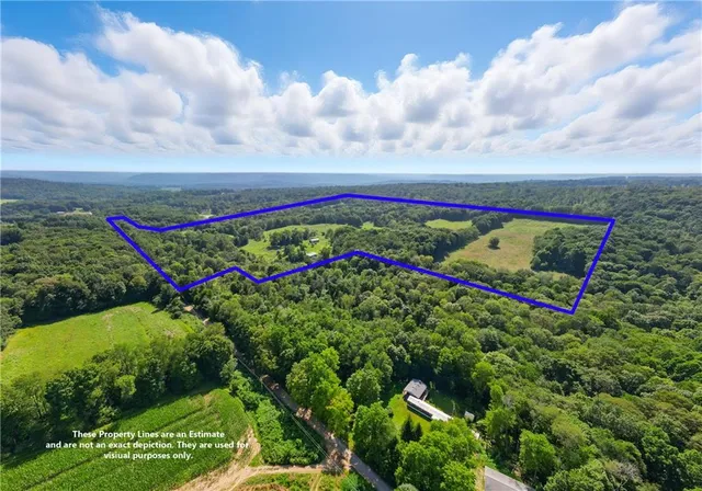 a large kitchen with stainless steel appliances lots of counter space and a sink