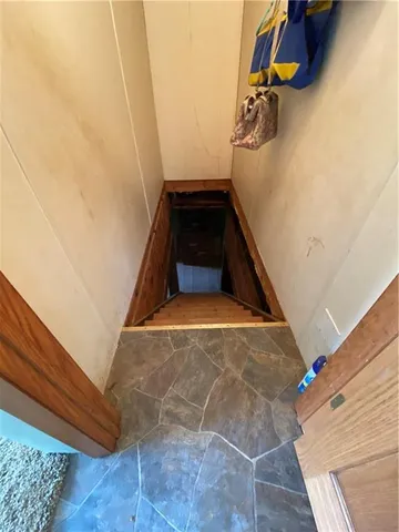 a view of a room with window and furniture