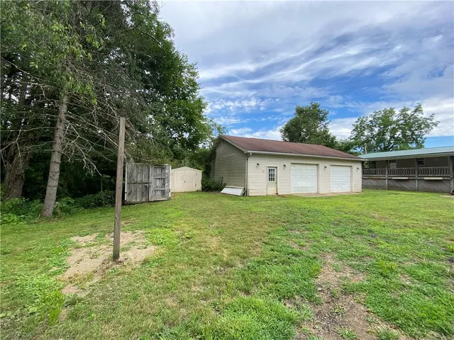 a view of a house with a back yard