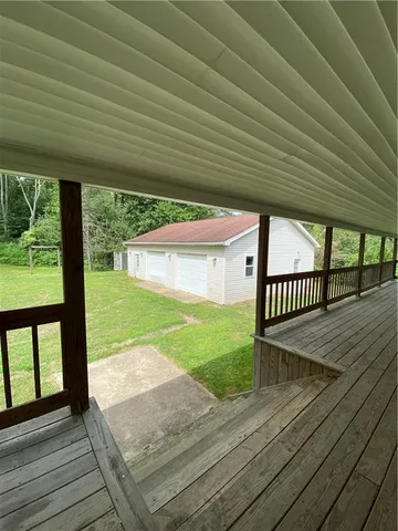 a view of a patio with wooden floor