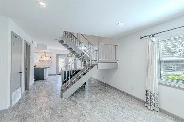 a view of a kitchen with granite countertop cabinets and wooden floor