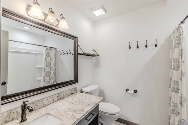 a bathroom with a bathtub and shower