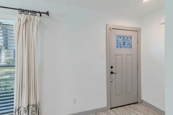 a view of an empty room with stairs