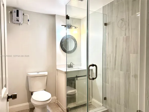 a bathroom with a toilet and a sink