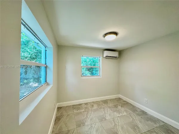 a view of an empty room with a window