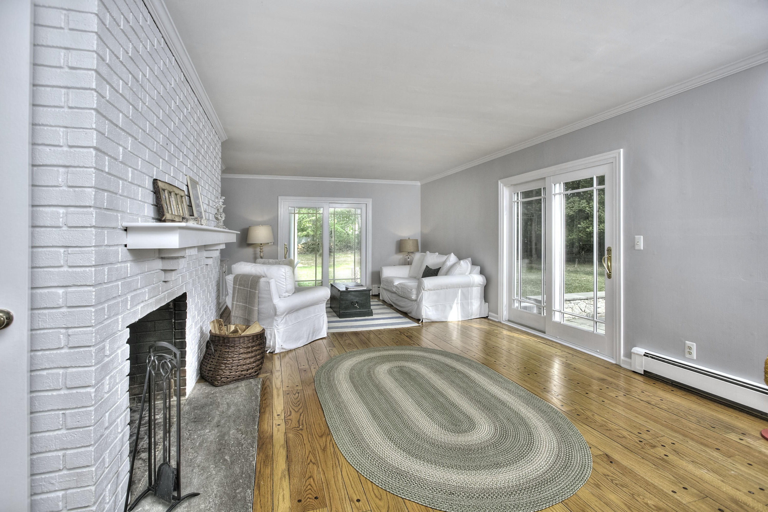 176 White Oak Shade Road New Canaan, CT 06840 - Photo 14 of 33 a living room with furniture and a fireplace