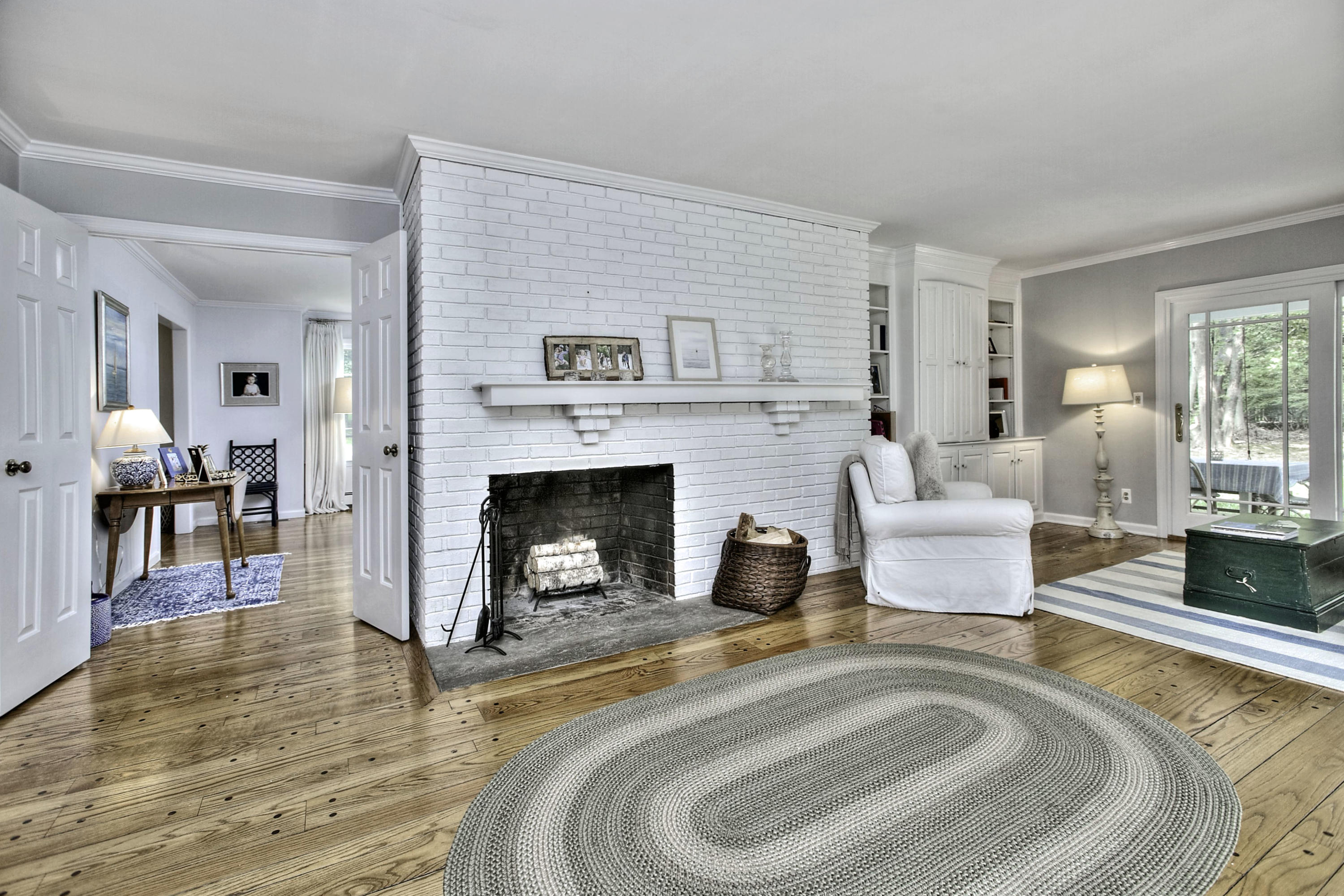 176 White Oak Shade Road New Canaan, CT 06840 - Photo 15 of 33 a living room with furniture and a fireplace