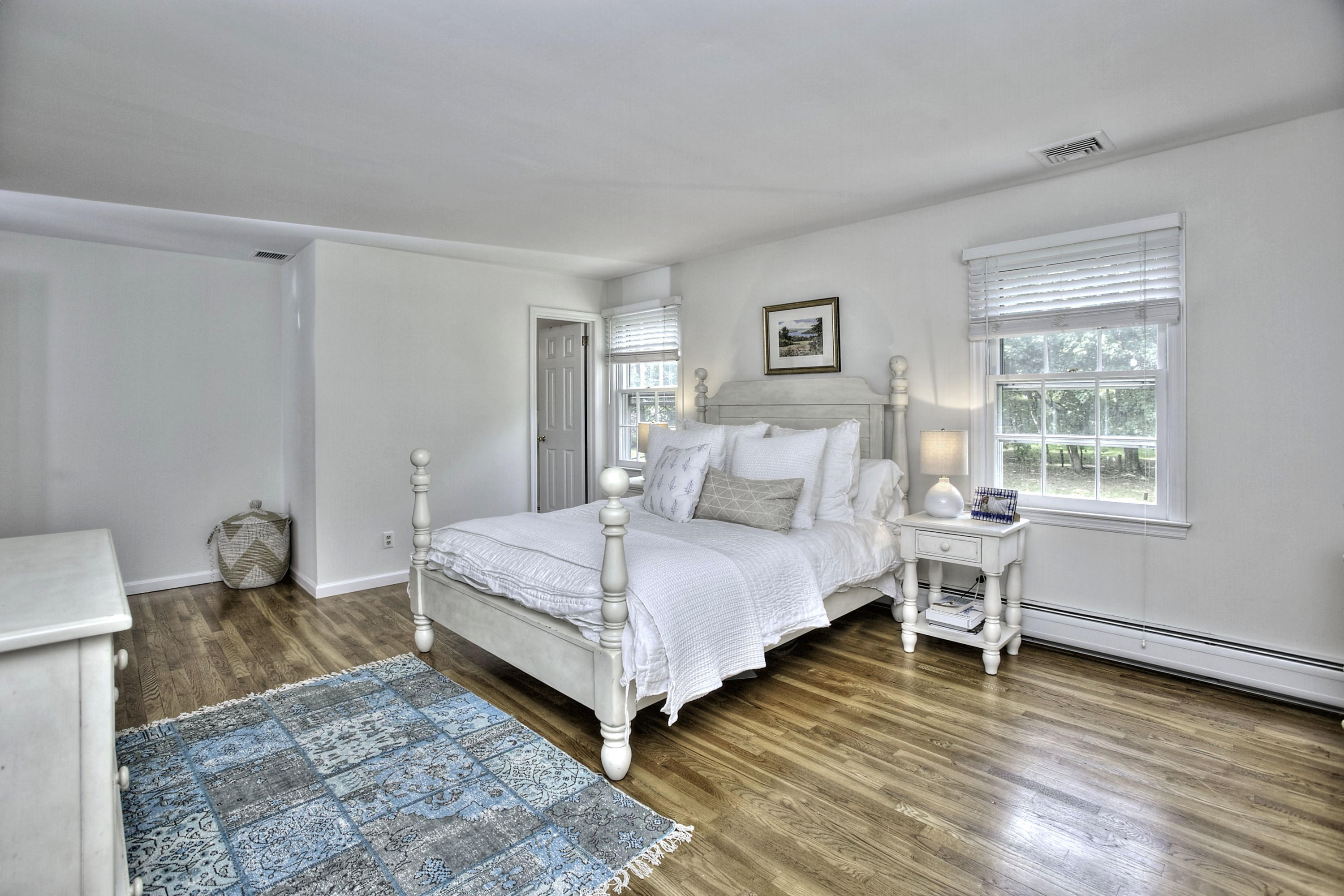 176 White Oak Shade Road New Canaan, CT 06840 - Photo 17 of 33 a bedroom with a bed and a chair