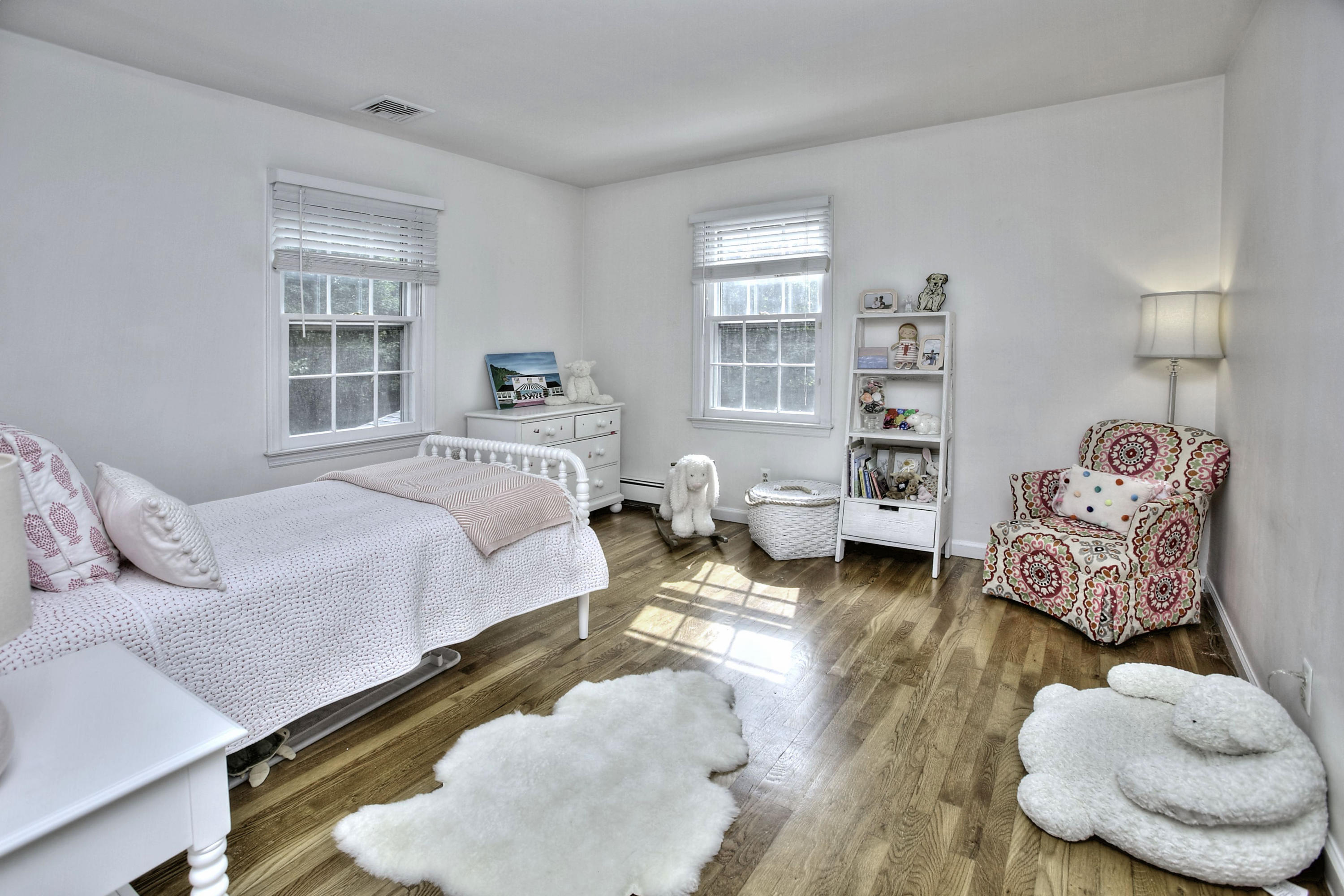 176 White Oak Shade Road New Canaan, CT 06840 - Photo 20 of 33 a bedroom with furniture and a wooden floor