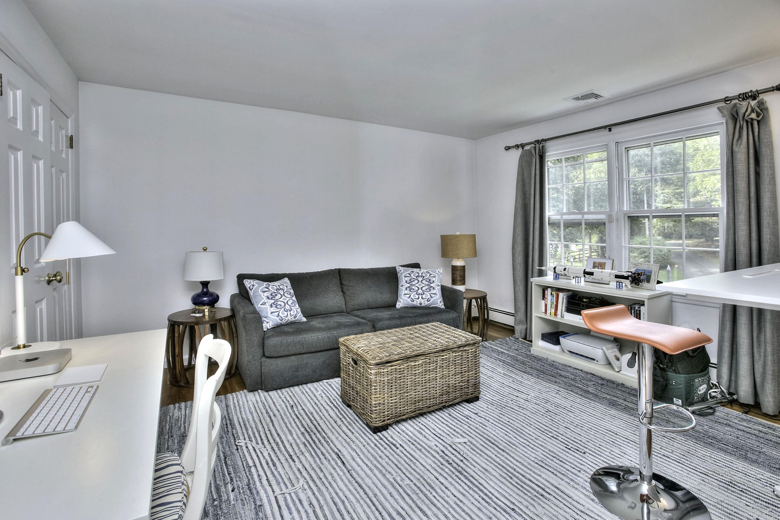 176 White Oak Shade Road New Canaan, CT 06840 - Photo 22 of 33 a living room with furniture a lamp and a large window
