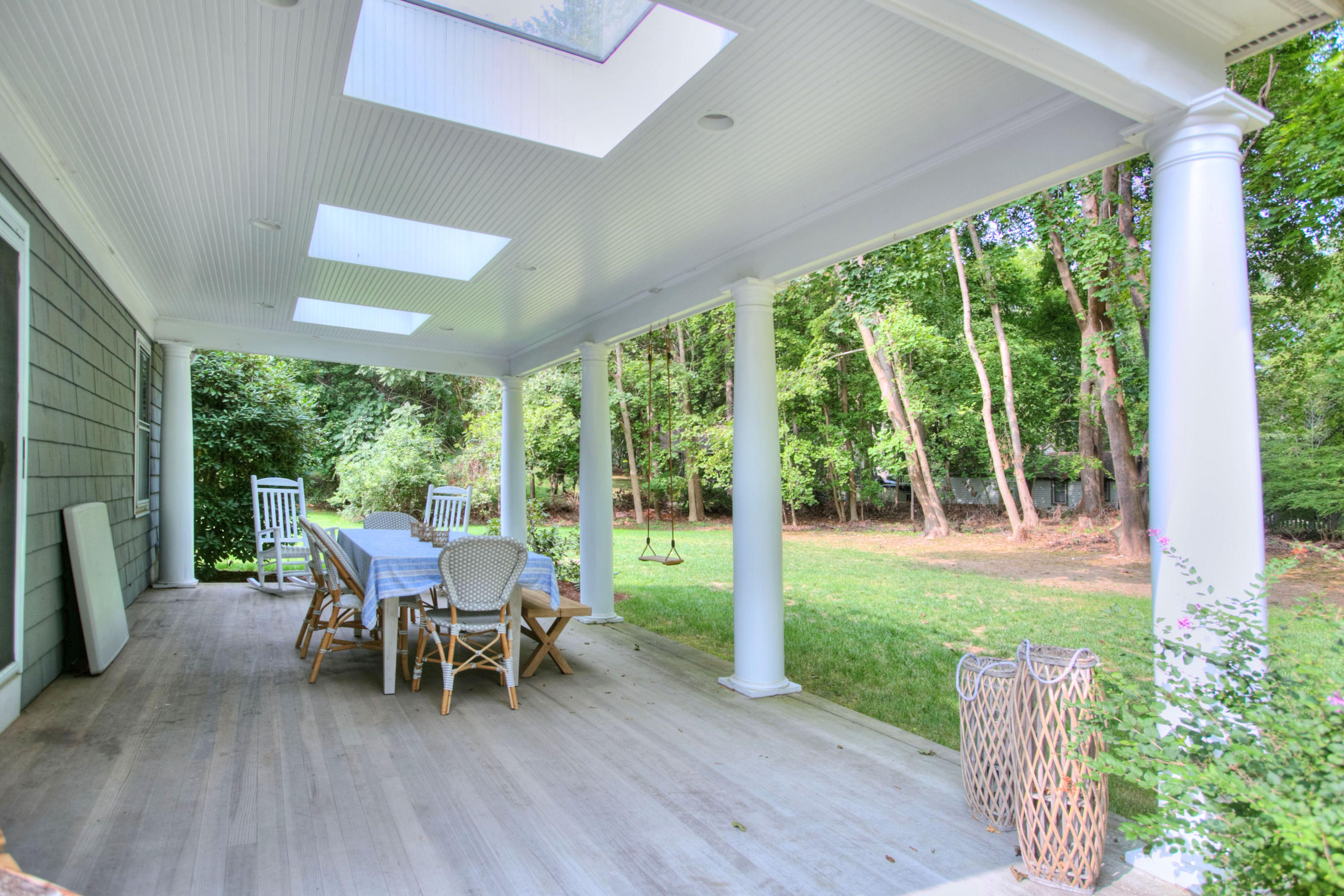 176 White Oak Shade Road New Canaan, CT 06840 - Photo 27 of 33 a view of a porch with chairs and backyard