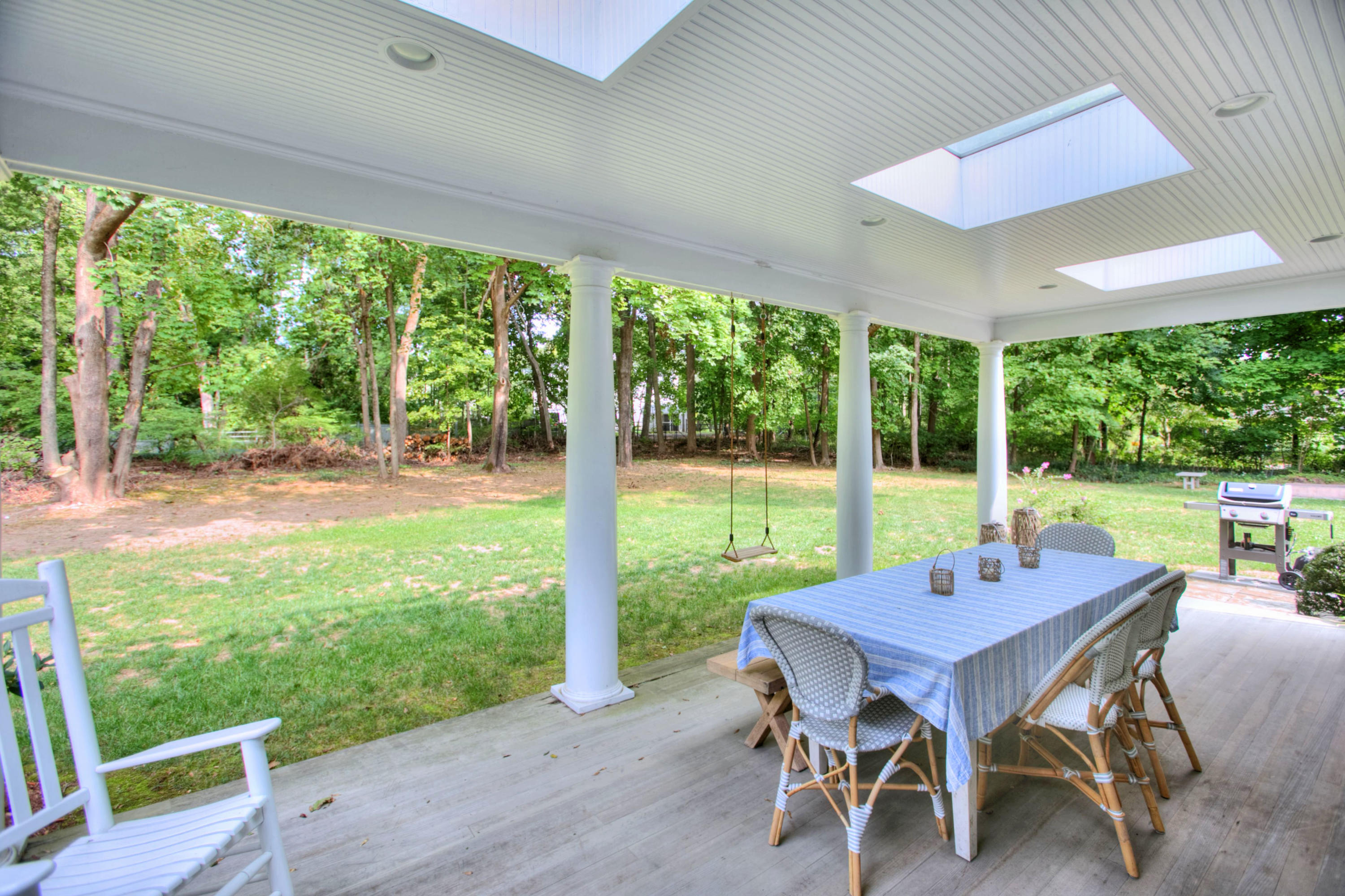 176 White Oak Shade Road New Canaan, CT 06840 - Photo 28 of 33 a view of a patio with a backyard table and chairs
