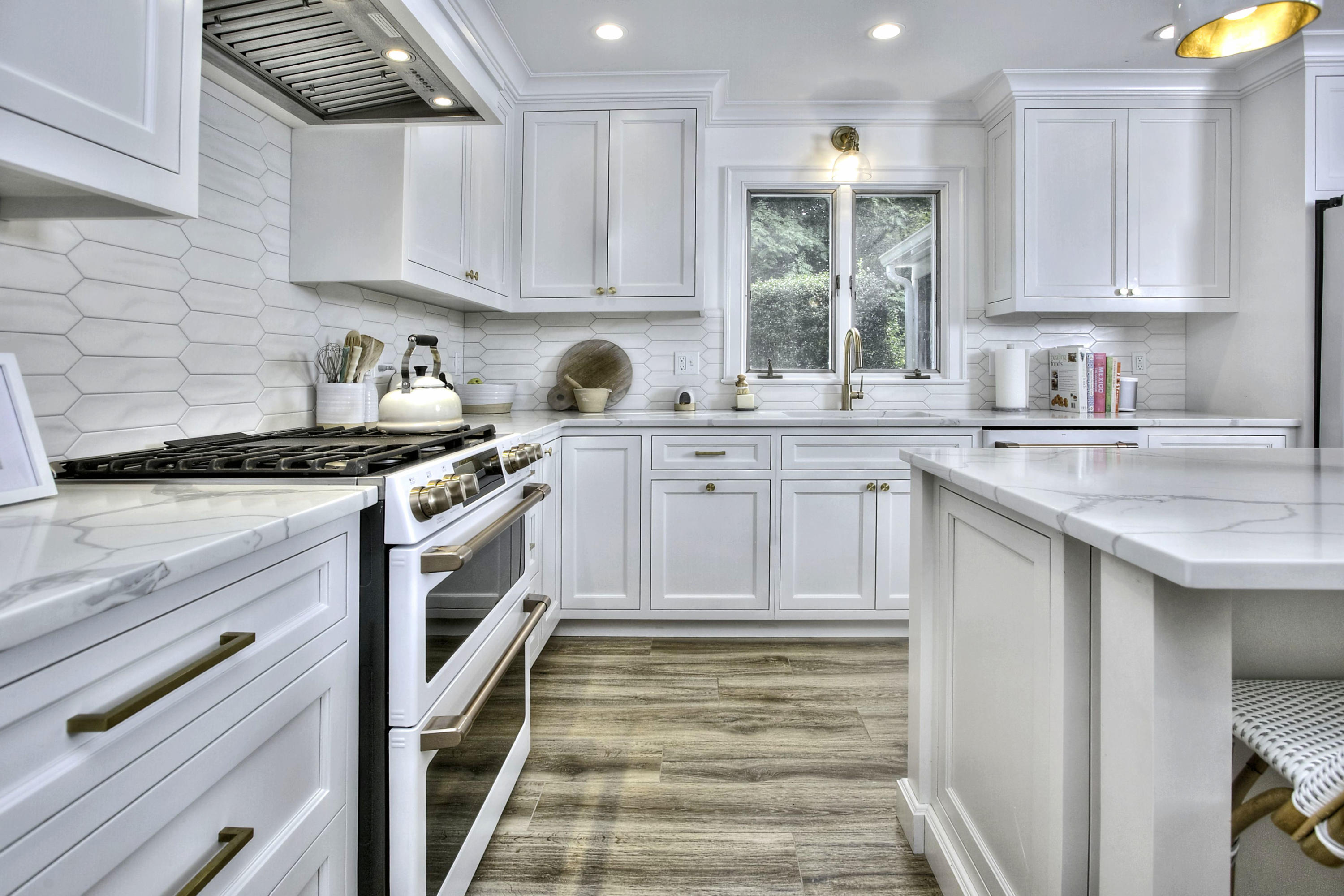 176 White Oak Shade Road New Canaan, CT 06840 - Photo 3 of 33 a kitchen with granite countertop a stove a sink and cabinets