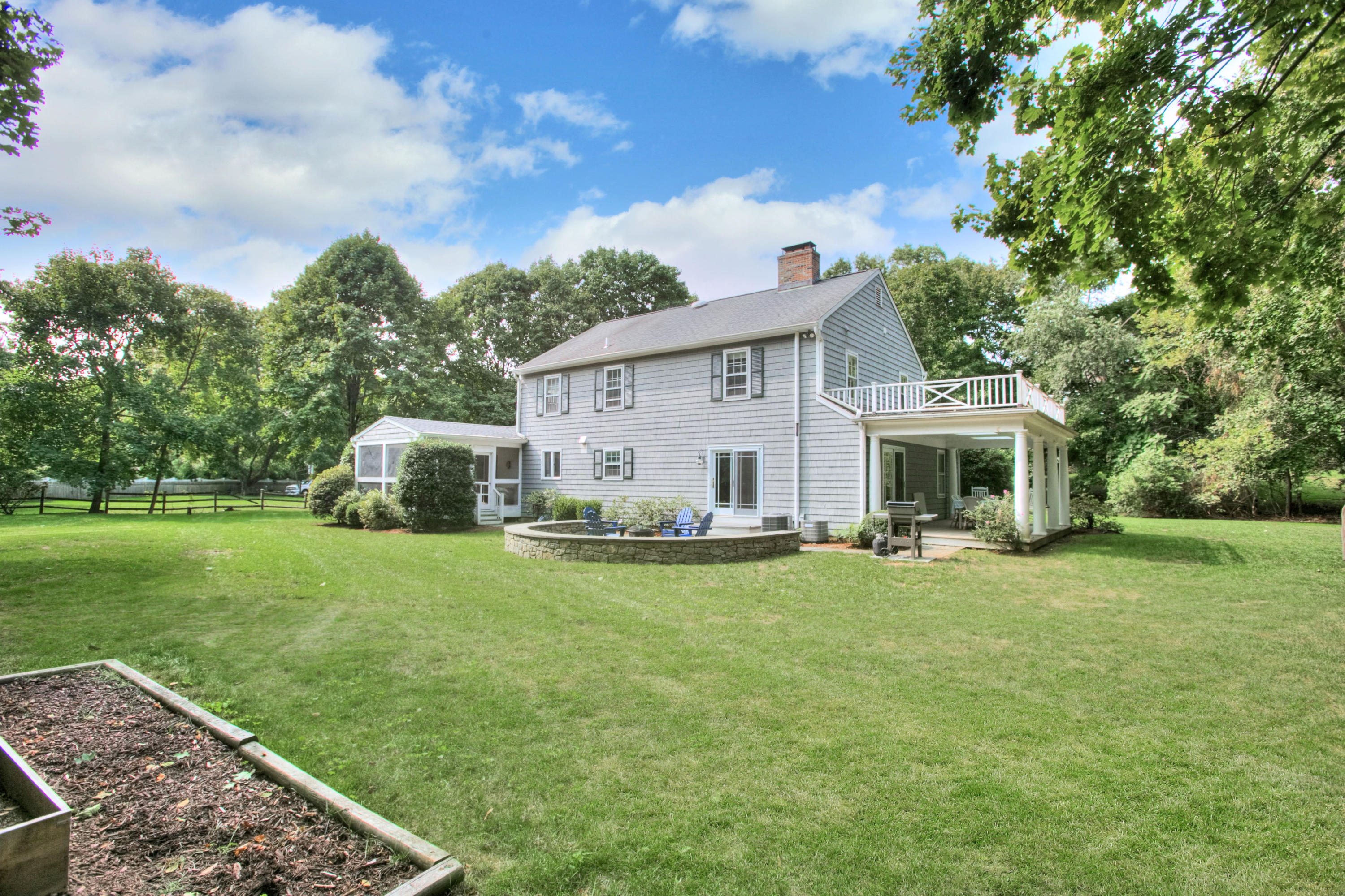 176 White Oak Shade Road New Canaan, CT 06840 - Photo 31 of 33 a view of a house with backyard sitting area and garden