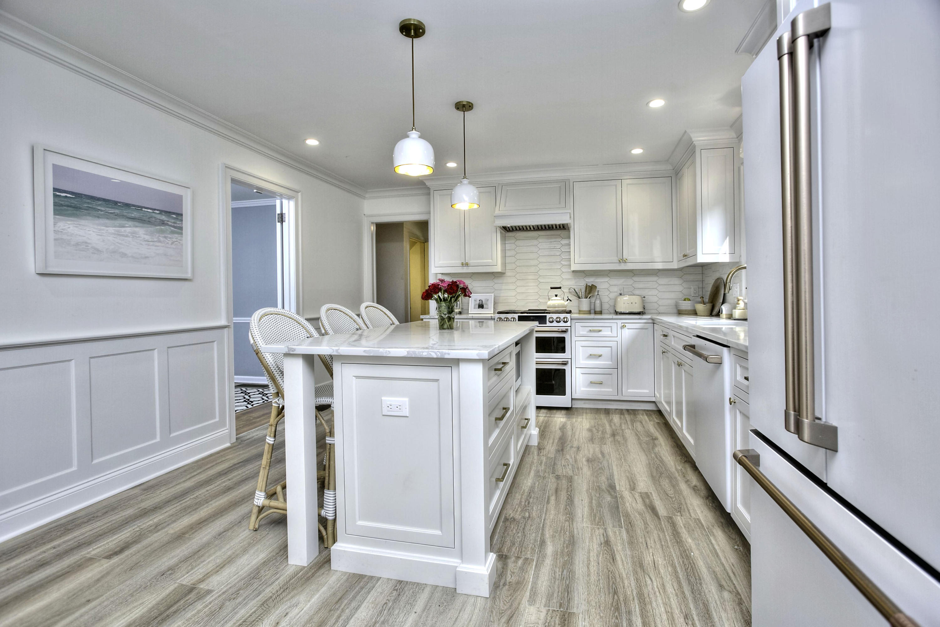 176 White Oak Shade Road New Canaan, CT 06840 - Photo 4 of 33 a kitchen with a sink a counter top space stainless steel appliances and cabinets