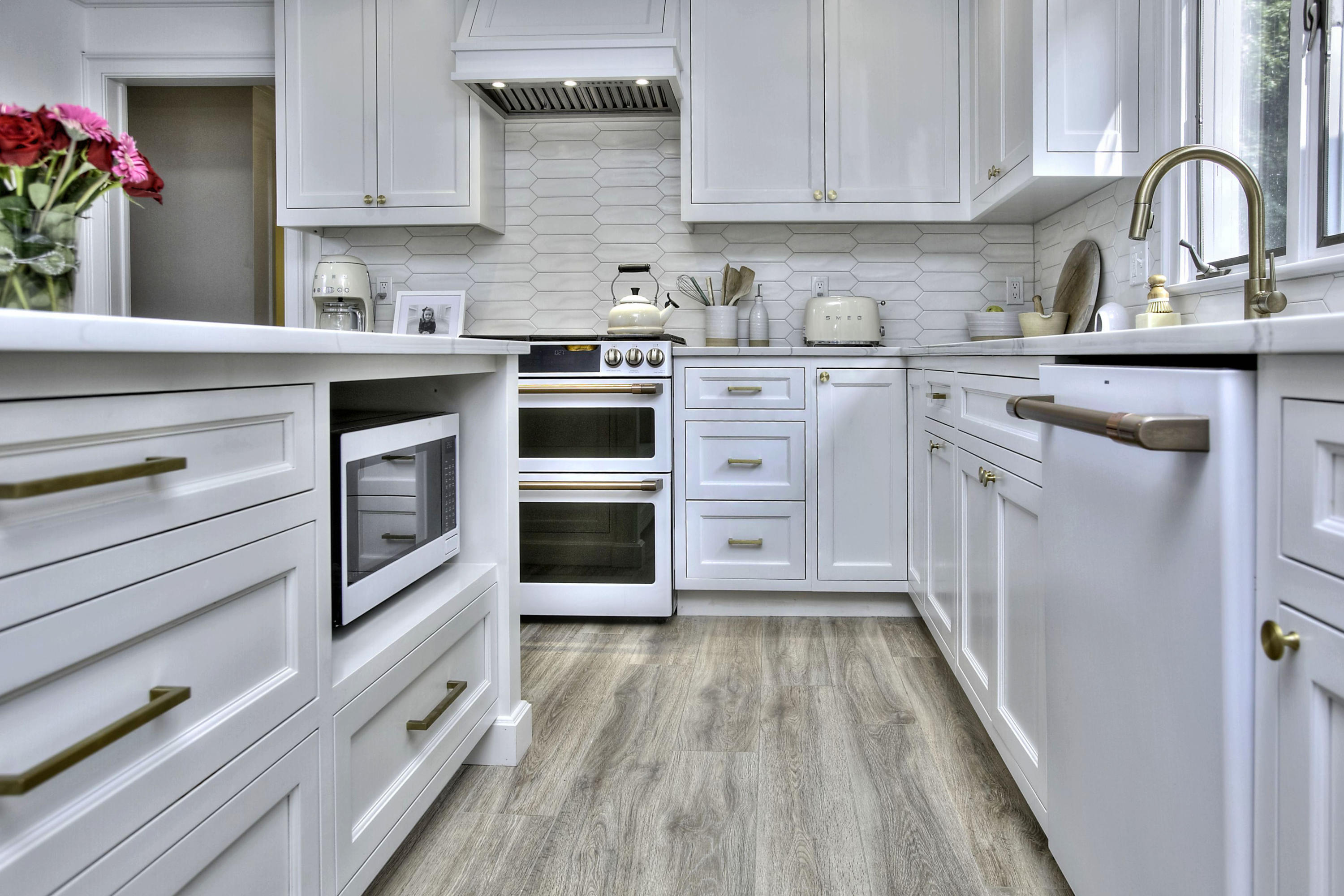 176 White Oak Shade Road New Canaan, CT 06840 - Photo 6 of 33 a kitchen with white cabinets stainless steel appliances and sink