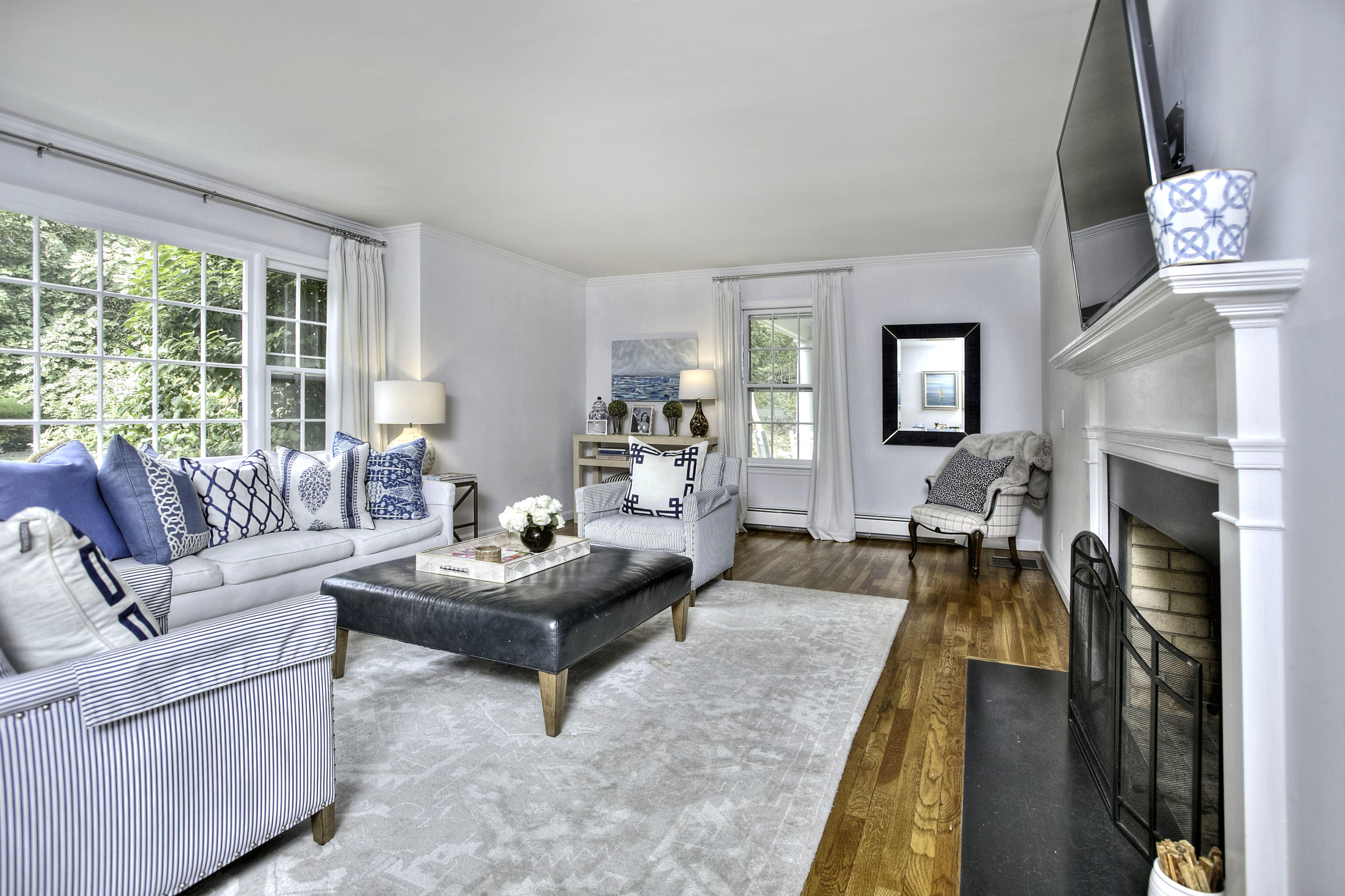 176 White Oak Shade Road New Canaan, CT 06840 - Photo 8 of 33 a living room with furniture and a fireplace