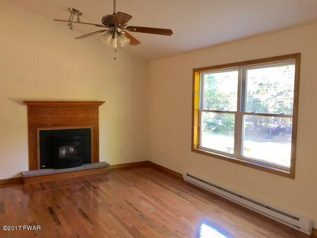 147 Rabbit Run Milford, PA 18337 - Photo 3 of 11 Living Room with Pellet Stove
