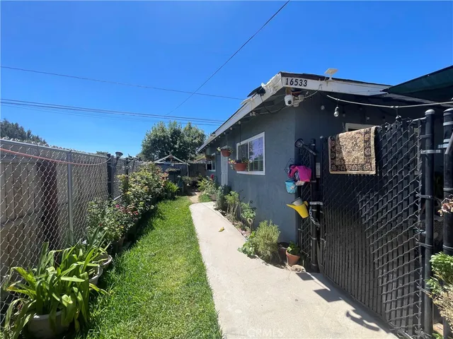 a view of a house with a yard patio and a patio