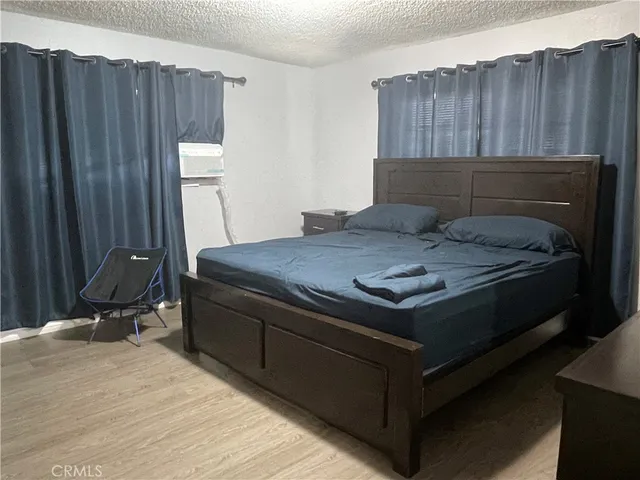 a room with a bed and cabinets