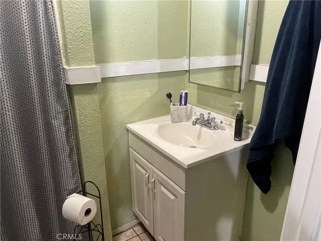 a bathroom with a sink and mirror