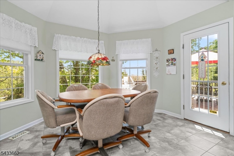 15 Bracken Hill Road Hamburg, NJ 07419 - Photo 18 of 44 a dining room with furniture a chandelier and window