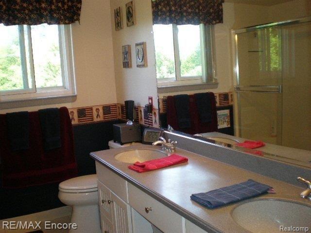 2965 Porter Road White Lake, MI 48383 - Photo 17 of 22 BATH CORIAN COUNTER WITH DBL SIN