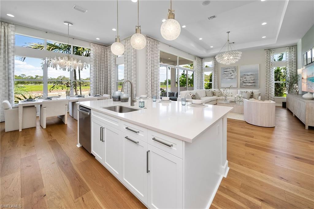 2695 Ridgecrest Place Naples, FL 34112 - Photo 13 of 13 Kitchen featuring a chandelier, light wood-style floors, open floor plan, and recessed lighting