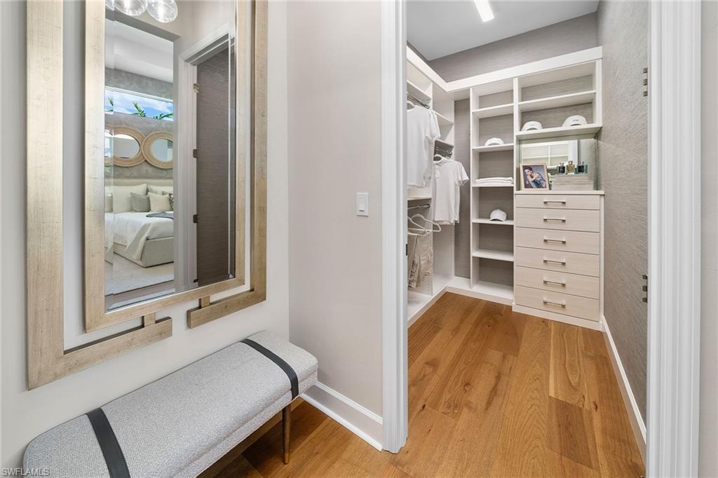 2695 Ridgecrest Place Naples, FL 34112 - Photo 6 of 13 Walk in closet featuring wood finished floors