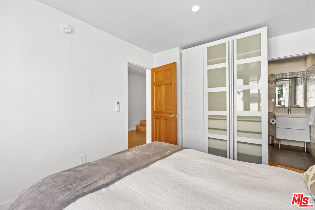 30 Voyage Street Marina del Rey, CA 90292 - Photo 13 of 21 a bedroom with a bed and closet