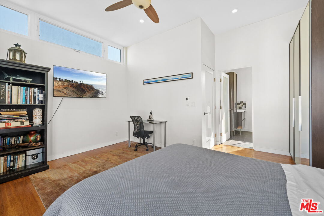 30 Voyage Street Marina del Rey, CA 90292 - Photo 16 of 21 a bedroom with a bed and a book shelf