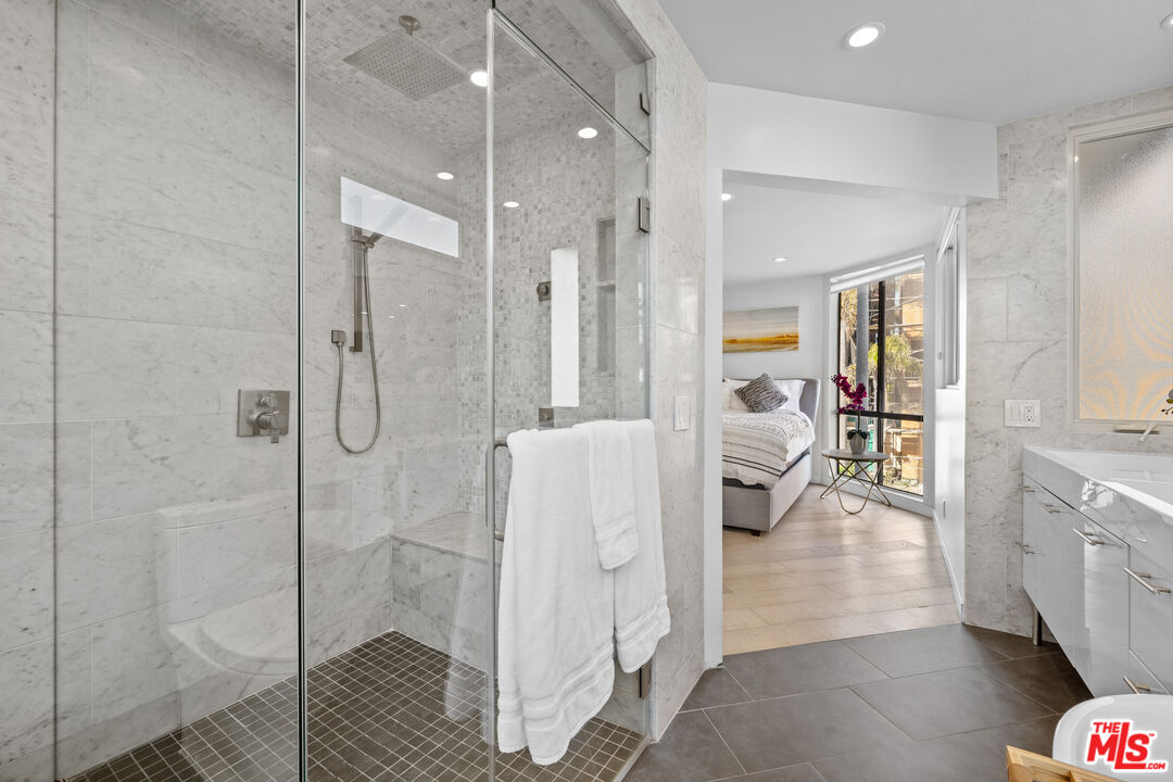 30 Voyage Street Marina del Rey, CA 90292 - Photo 9 of 21 a spacious bathroom with a glass door shower
