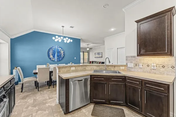 a kitchen with a sink and cabinets