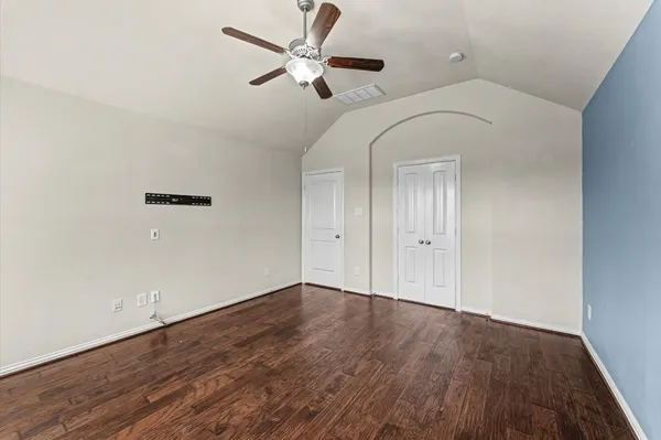 a view of walk in closet with empty racks