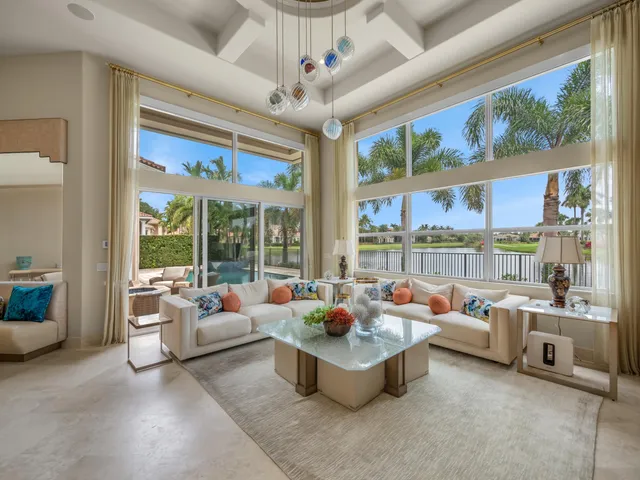a reading room with furniture and a large window