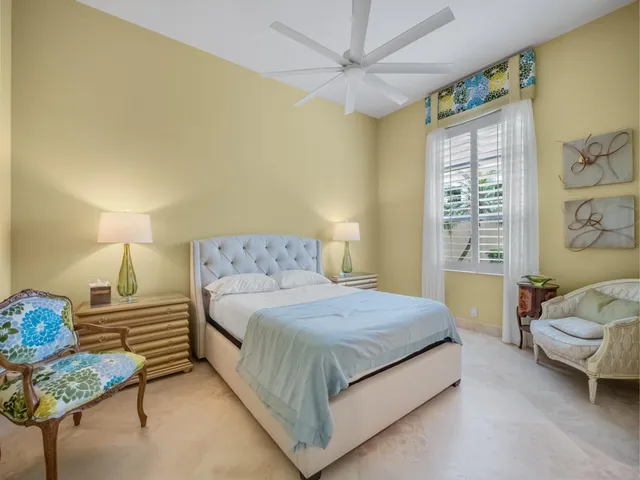 a bedroom with a bed and chandelier