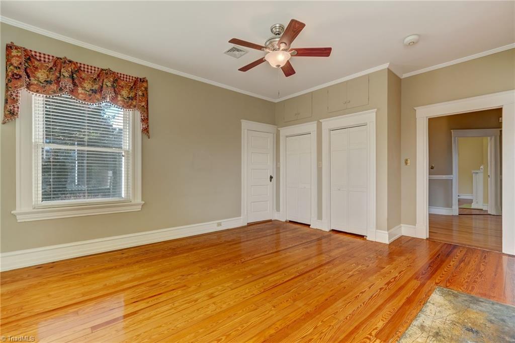 521 Patrick Street Eden, NC 27288 - Photo 36 of 50 Primary bedroom leading to en suite bathroom with more closet space