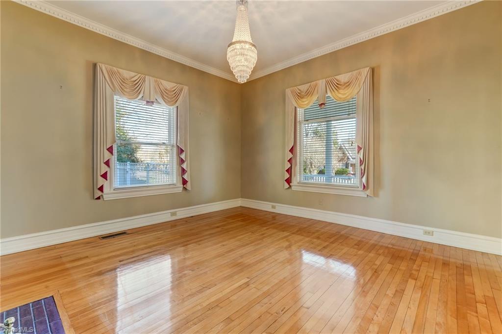 521 Patrick Street Eden, NC 27288 - Photo 6 of 50 Living room with perfect hardwoods and chandelier