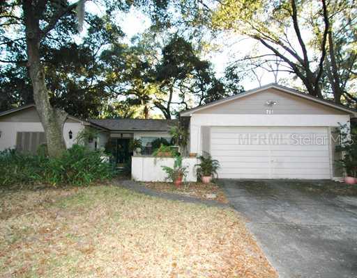 715 Little Wekiva Road Altamonte Springs, FL 32714 - Photo 1 of 1 a view of a house with a yard and large tree