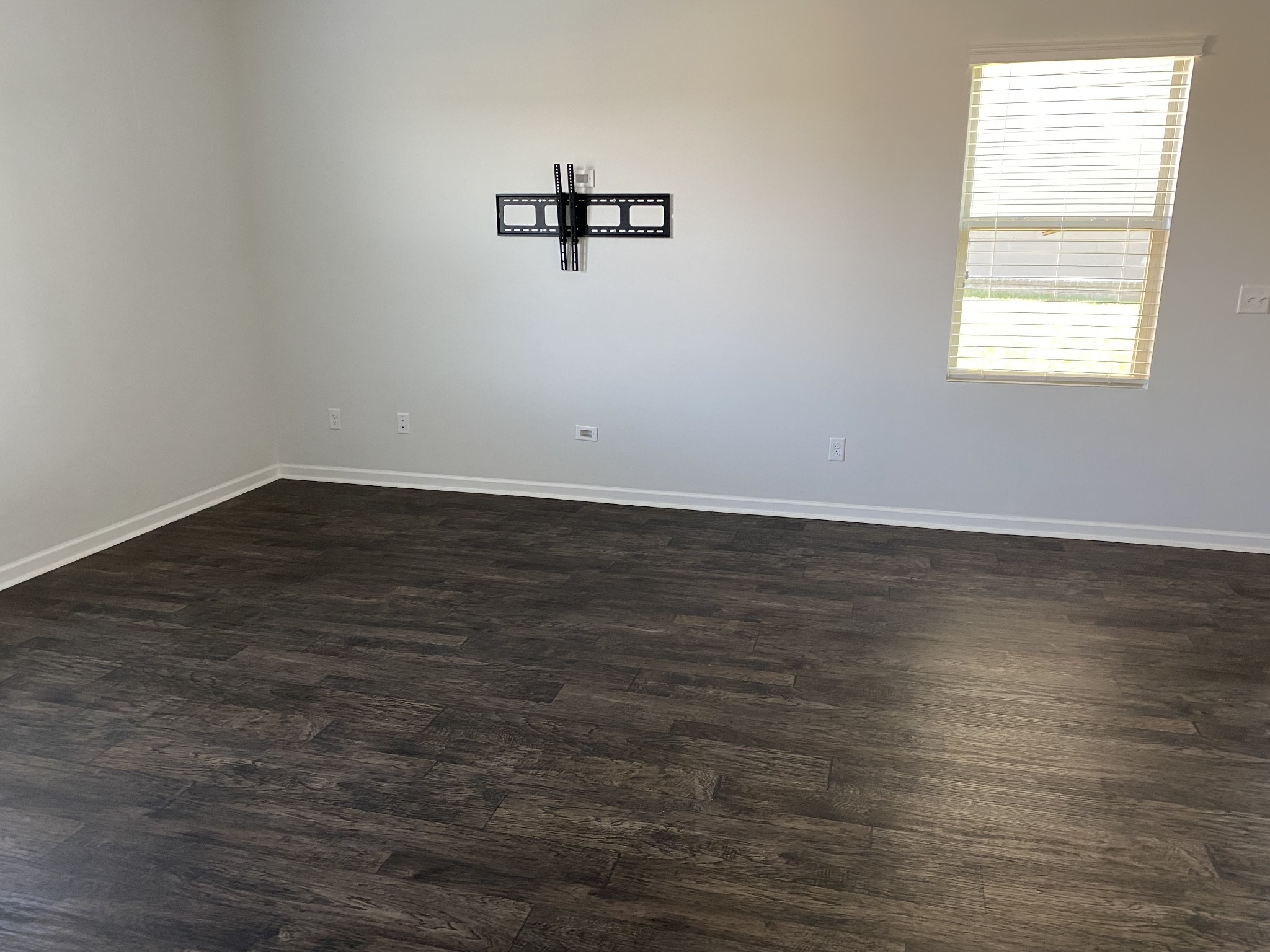 1024 Lonergan Circle Spring Hill, TN 37174 - Photo 6 of 8 an empty room with wooden floor and windows