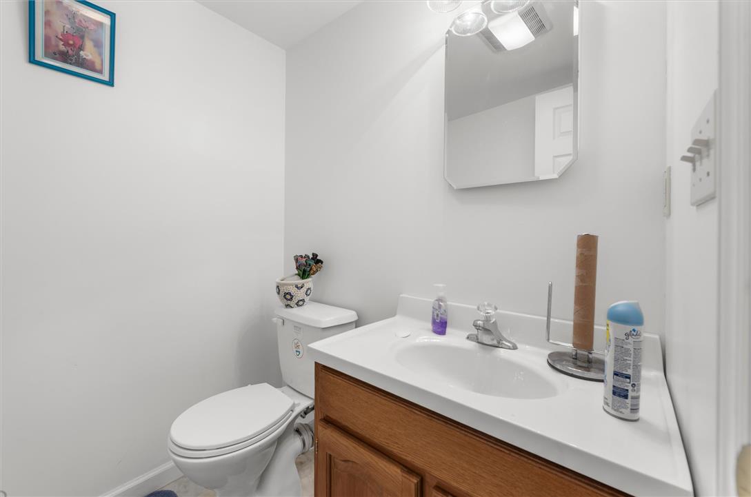 1255 Spring Road Easton, PA 18040 - Photo 19 of 23 A classic wood vanity and integrated sink define this crisp half bathroom layout.