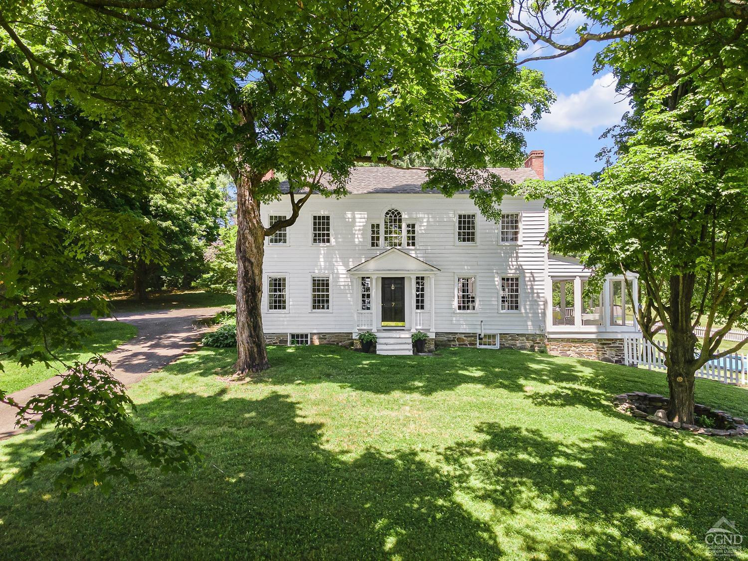 7 Thomas Road Chatham, NY 12184 - Photo 1 of 25 a view of a house with a big yard plants and large trees