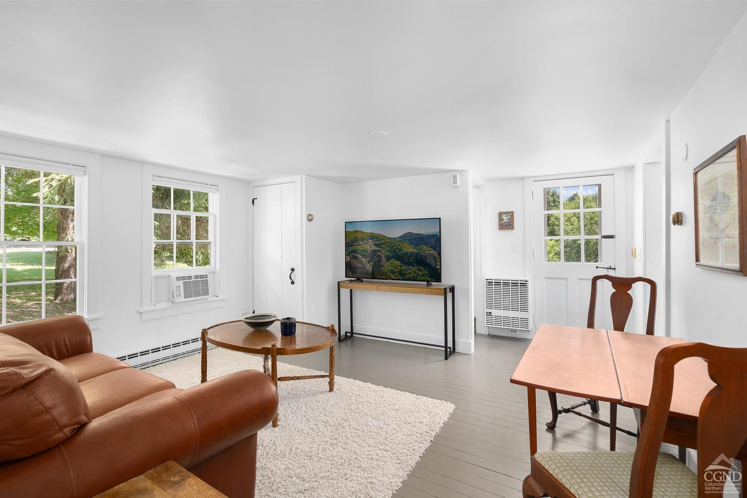 7 Thomas Road Chatham, NY 12184 - Photo 16 of 25 a living room with furniture and a flat screen tv