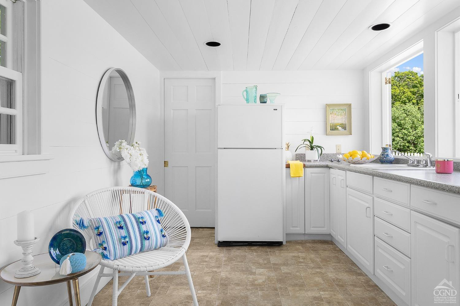 7 Thomas Road Chatham, NY 12184 - Photo 23 of 25 a kitchen with stainless steel appliances granite countertop a refrigerator sink and white cabinets