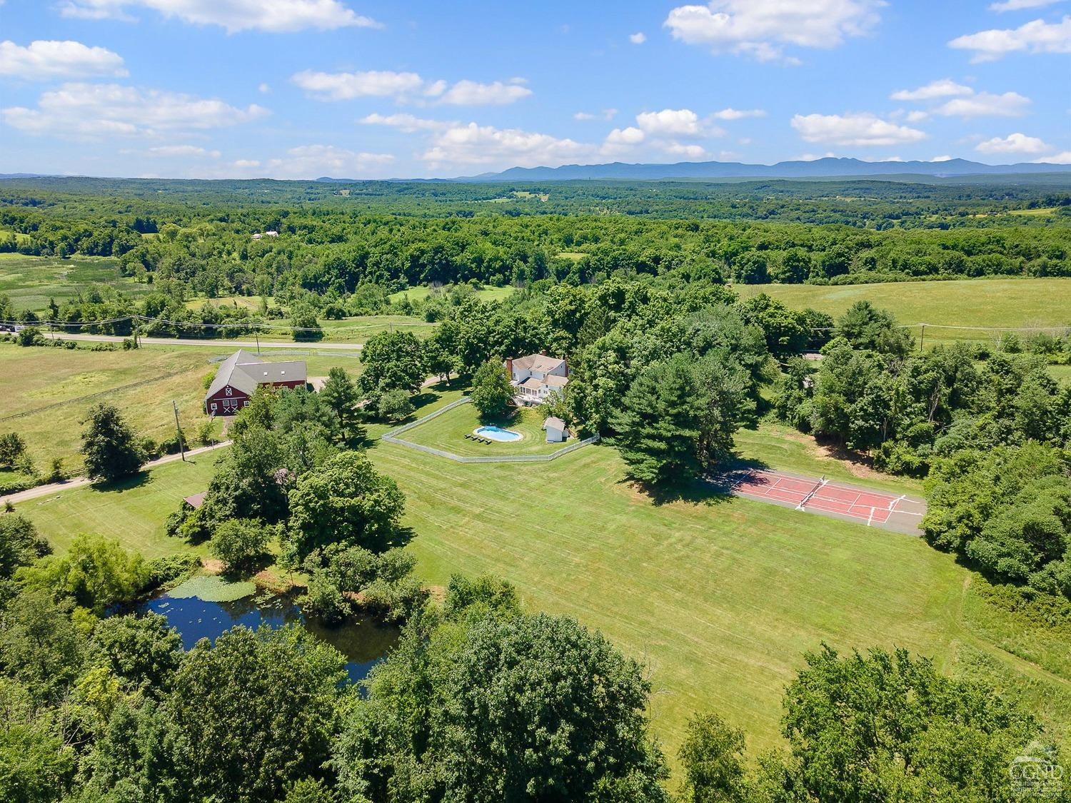 7 Thomas Road Chatham, NY 12184 - Photo 3 of 25 a view of a lake with a mountain in the background